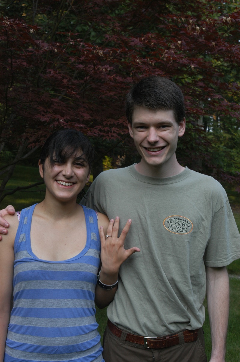 ring in front of a Japanese maple